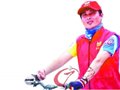 深圳大运会志愿者王伟——骑行“王子”倡导绿色生活(组图)